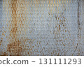 Texture of a ribbed, rusty metal surface with a diamond pattern 131111293