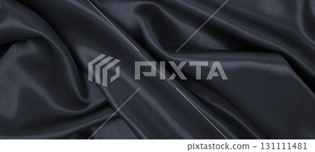 Smooth elegant dark grey silk or satin luxury cloth texture as abstract background. Luxurious background design 131111481