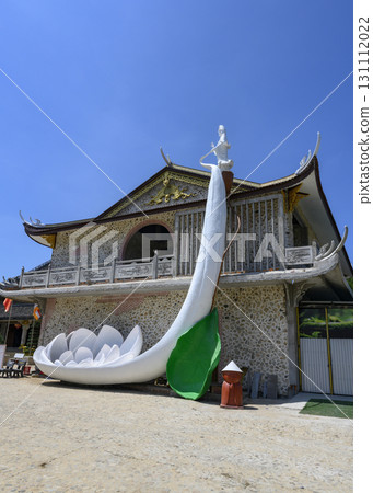 Sculpture of Goddess Guanyin with big lotus in Thanh Luong Pagoda of 18 century in Phu Yen, Vietnam 131112022
