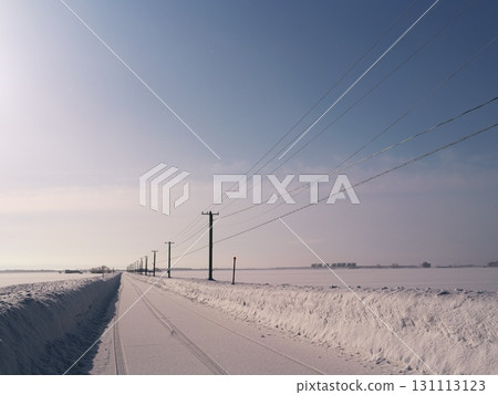 A single road covered in snow in Iwamizawa, Hokkaido, in the harsh winter A single road covered in snow in Iwamizawa, Hokkaido, in the harsh winter 131113123