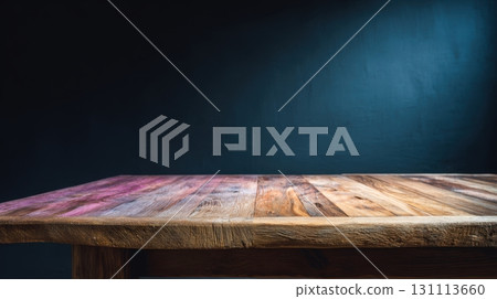 Rustic Wooden Table Against Dark Wall in Dimly Lit Room 131113660