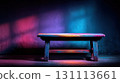 Wooden Table Against Black Wall in Dark Room with Vibrant Colors 131113661