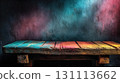 Vibrant Wooden Table Against Black Wall in Dark Room Atmosphere 131113662