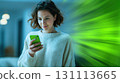 Young Adult Woman Shopping at Home on Smartphone with Green Background 131113665