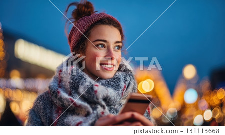 Young Woman Enjoys Christmas Shopping While Gazing at Her Phone Young Woman Enjoys Christmas Shopping While Gazing at Her Phone 131113668