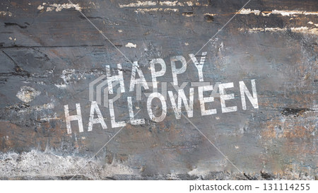 Text of Happy Halloween on the grungy gray wall background. Concept of Happy Halloween Text of Happy Halloween on the grungy gray wall background. Concept of Happy Halloween 131114255