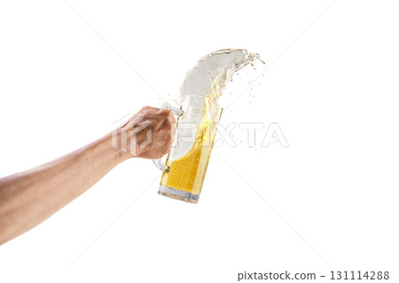 Human hands holding a beer mug with a splash of beer isolated over a white background. Oktoberfest festival Human hands holding a beer mug with a splash of beer isolated over a white background. Oktoberfest festival 131114288