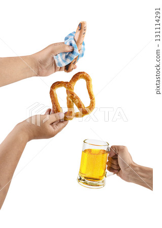 Human hands holding a sausage with a blue checkered tablecloth or napkin, pretzel loaf, and beer mug isolated over a white background. Oktoberfest festival Human hands holding a sausage with a blue checkered tablecloth or napkin, pretzel loaf, and beer mug isolated over a white background. Oktoberfest festival 131114291