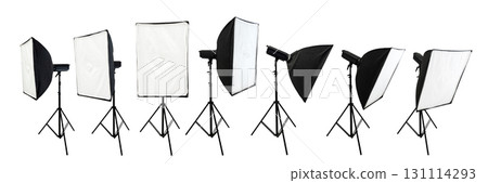Collection set of professional studio lighting equipment with a softbox on a tripod isolated over a white background 131114293