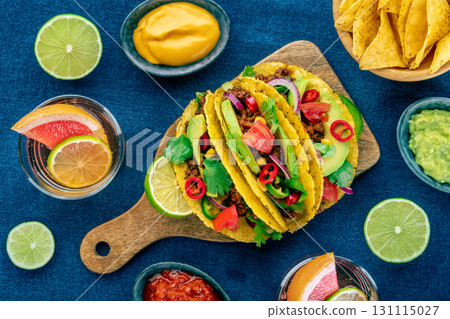 Tacos and Paloma cocktails, Mexican food, overhead flat lay shot, with limes 131115027