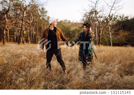 Lovely hipster couple enjoying each other in the autumn park. Nice autumn day. love and lifestyle. 131115145
