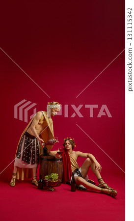 Two men in togas with barrel and wine jug in festive scene Two men in togas with barrel and wine jug in festive scene 131115342