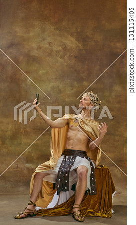 Man in Caesar costume posing for selfie with theatrical dramatic posture 131115405