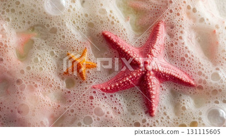 Two starfishes with tiny bubbles resting on a tropical beach, showcasing marine beauty, peaceful nature, and vacation vibes through a relaxing coastal scene of the natural seaside 131115605