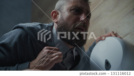 Businessman with Tense Facial Expression Suffering from Diarrhea and Indigestion, Sitting on the Toilet 131116012