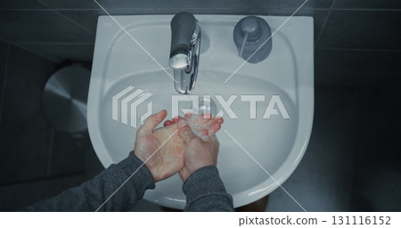 Businessman Cleaning and Washing His Hands. Hand Hygiene after Using the Toilet in Restroom of Modern Office Businessman Cleaning and Washing His Hands. Hand Hygiene after Using the Toilet in Restroom of Modern Office 131116152