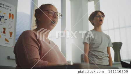 Talented Boy Singing Song During Vocal Lesson. Music Teacher Playing Piano, Training Young Student 131116209