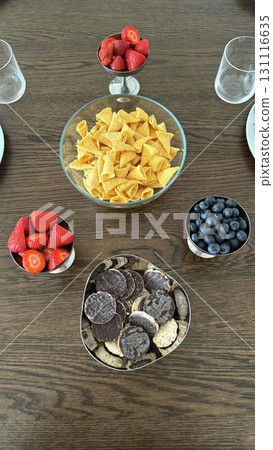 Assorted sweet treats with berries and chips Assorted sweet treats with berries and chips 131116635