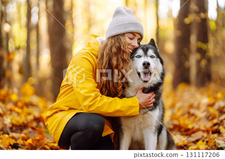 A pet owner spends time with her dog. Concept of fun, entertainment. 131117206