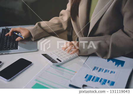 Portrait of young Hispanic professional business woman standing in office. Happy female company executive, smiling businesswoman entrepreneur corporate leader manager looking at camera using tablet Portrait of young Hispanic professional business woman standing in office. Happy female company executive, smiling businesswoman entrepreneur corporate leader manager looking at camera using tablet 131119043