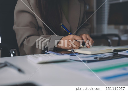 Portrait of young Hispanic professional business woman standing in office. Happy female company executive, smiling businesswoman entrepreneur corporate leader manager looking at camera using tablet Portrait of young Hispanic professional business woman standing in office. Happy female company executive, smiling businesswoman entrepreneur corporate leader manager looking at camera using tablet 131119057