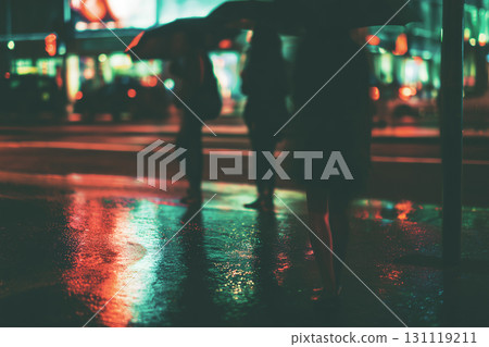 City street at night with silhouettes and neon reflections in the rain City street at night with silhouettes and neon reflections in the rain 131119211