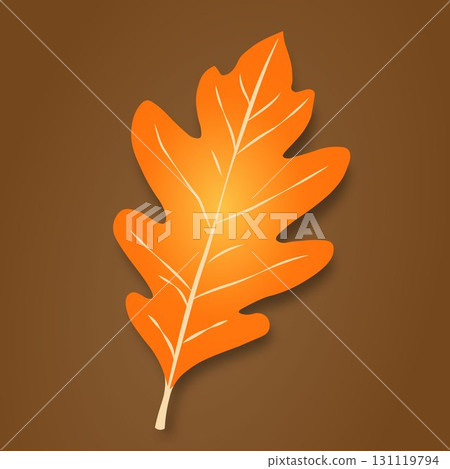 The autumn leaf is orange-yellow in color with light streaks and shadows on a brown background. 131119794