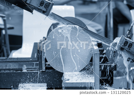 The band saw cutting machine cutting the metal shaft parts with coolant method in the light blue scene. 131120025