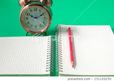 Top view of red pencil on book note. 131120250