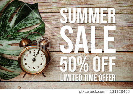 Summer Sale 50% Off text with alarm clock and monstera leaf on wooden background Summer Sale 50% Off text with alarm clock and monstera leaf on wooden background 131120463