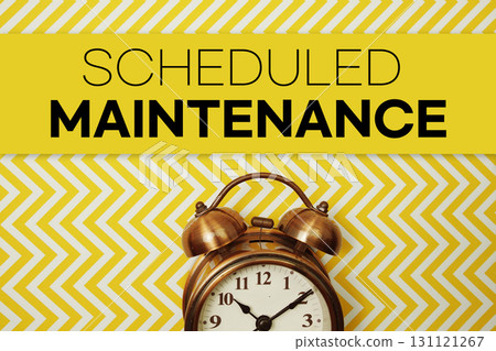 Scheduled Maintenance text with alarm clock on yellow background 131121267