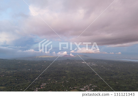 Sunset over lush hills and clouds in countryside 131121343