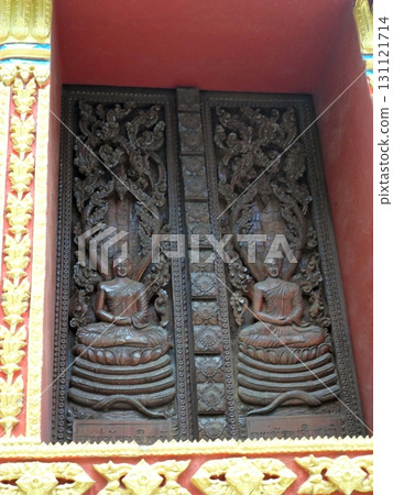 An Intricately Carved Wooden Temple Door with Meditating Figures and Floral Designs 131121714