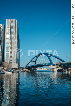 Sokcho harbor with fishing boats and modern skyscrapers, South Korea Sokcho harbor with fishing boats and modern skyscrapers, South Korea 131122354