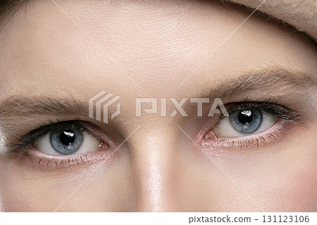 Blue eyes of a girl close up. Part of the face. Blue eyes of a girl close up. Part of the face. 131123106