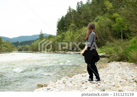 Teen Girl Walking Along the River in Nature 131123139