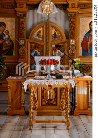 Eastern Orthodox Church Altar with Red Roses and Icons, Wooden Interior, Religious Ceremony, Golden Accents, Detailed Carvings, Spiritual Scene 131123204