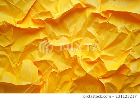 A vibrant yellow, close-up view of a crumpled piece of paper, showing a highly textured surface with numerous folds, creases, and shadows. A vibrant yellow, close-up view of a crumpled piece of paper, showing a highly textured surface with numerous folds, creases, and shadows. 131123217