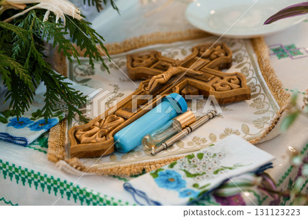 Holy Communion Ritual with Medical Syringe on Altar Cloth, Religious Ceremony, Cross, Faith, Blue and White Color Scheme. 131123223