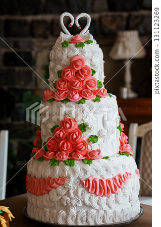 Elegant Three-Tier Wedding Cake with Coral Roses and Swirl Frosting, Heart Topper, Classic Celebration, Romantic Decor, White and Pink Hues Elegant Three-Tier Wedding Cake with Coral Roses and Swirl Frosting, Heart Topper, Classic Celebration, Romantic Decor, White and Pink Hues 131123269