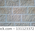 This surface features tiles designed to look like stonework, showcasing a textured and rugged finish ideal for various settings. It provides a natural look that suits many styles. 131123372