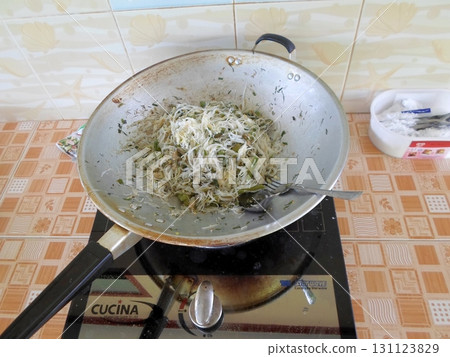 A Sliced Dragon Fruit with White Flesh and Black Seeds on a Plate with a Knife and Apple Slices Nearby A Sliced Dragon Fruit with White Flesh and Black Seeds on a Plate with a Knife and Apple Slices Nearby 131123829