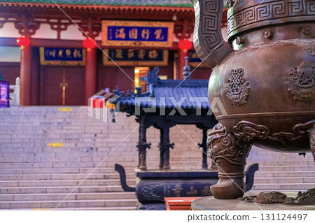Hainan Island, Sanya: Nanshan Buddhist Center. View of the incense burner in front of the Temple Hainan Island, Sanya: Nanshan Buddhist Center. View of the incense burner in front of the Temple 131124497