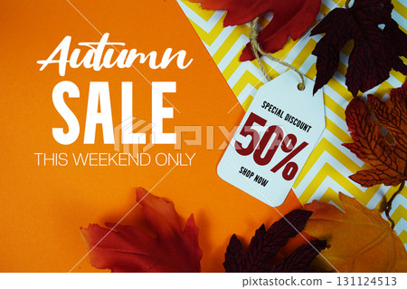 Autumn Sale 50% Off with Price Tag and maple leaf decorated on orange background 131124513