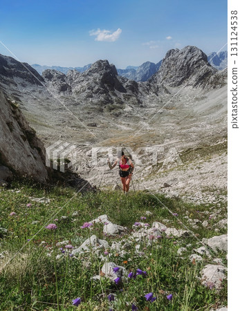 Young Woman Hiking in Albanian Alps Mountains Young Woman Hiking in Albanian Alps Mountains 131124538