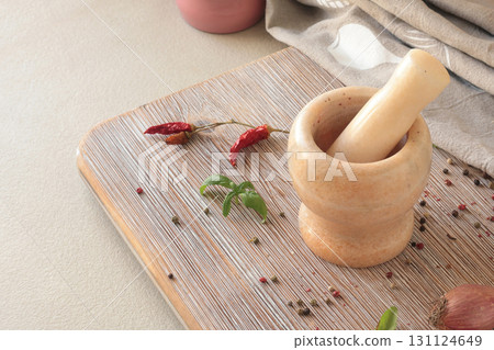 Marble mortar in kitchen. Food and cooking. Healthy eating and organic products. Marble mortar in kitchen. Food and cooking. Healthy eating and organic products. 131124649