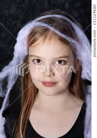 Little girl on the halloween spider web. Little girl on the halloween spider web. 131124680