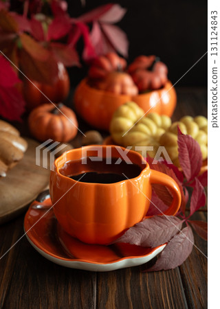 Autumn Composition with Pumpkin Mug, Bundt Cake and Seasonal Decor Autumn Composition with Pumpkin Mug, Bundt Cake and Seasonal Decor 131124843