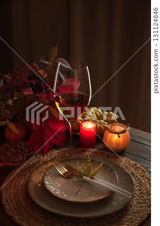 Autumn Table Setting with Pumpkins, Candles and Leaf Decor 131124846