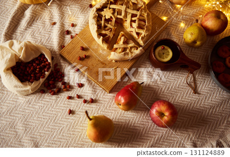 Autumn Thanksgiving Table Scene With Lattice Pie, Fruits, And Cozy Lights 131124889